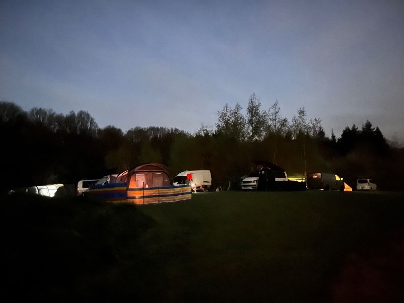 Tents on our wildflower view field in the moonlight