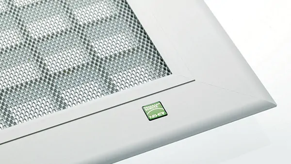 Detail view of the Terresa window well cover by Neher featuring a sturdy aluminum frame and non-slip expanded metal mesh.