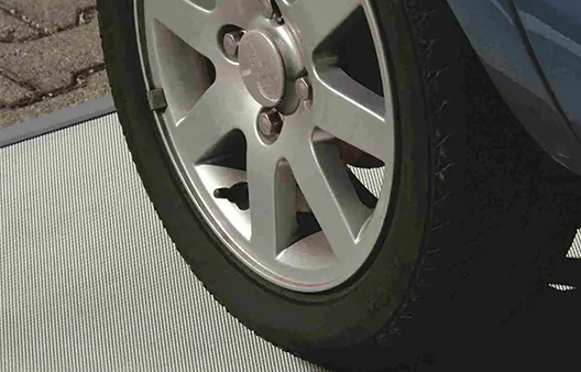 Drive-on window well cover with expanded metal – highly durable construction suitable for vehicle loads, ideal for driveways and heavily used outdoor areas.