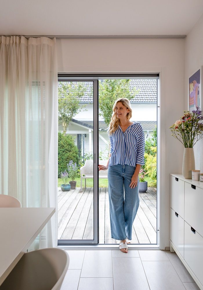 Large patio door with integrated insect screen – bright living space with direct garden access