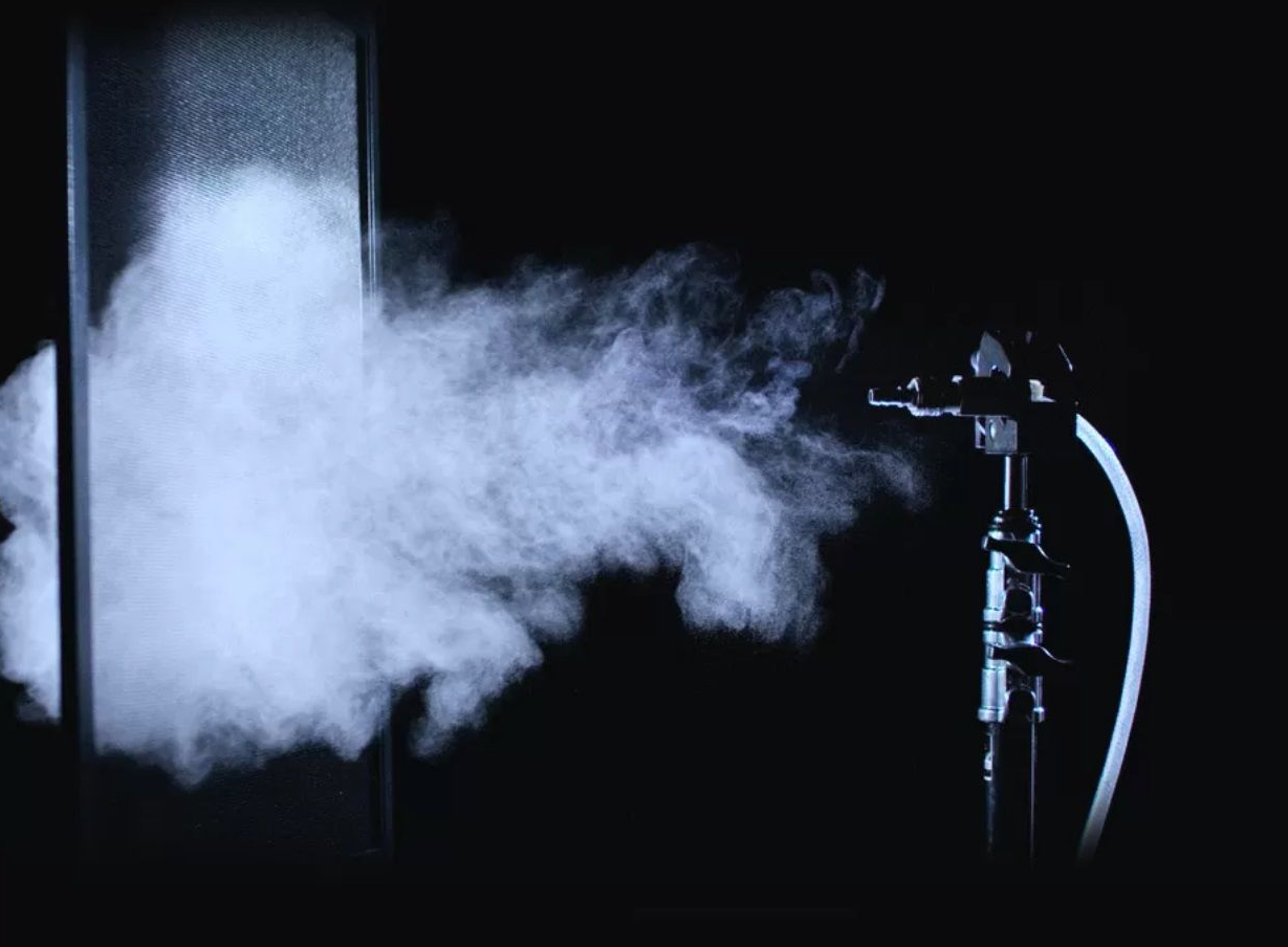 Demonstration of the high air permeability of Transpatec® insect screen mesh – smoke test visualizing optimal airflow in insect protection solutions by ISK Systeme.