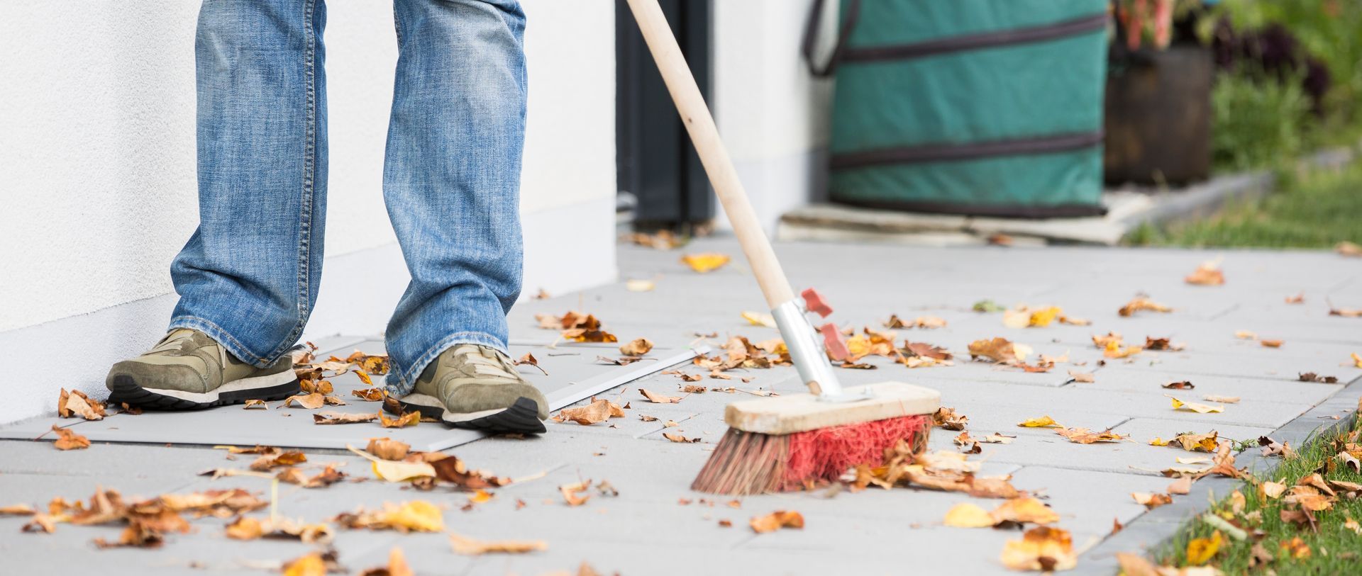 Cleaning fallen leaves from a terrace – well-maintained outdoor living area