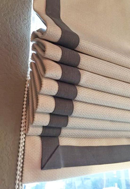 Custom flat roman shade with blue trim