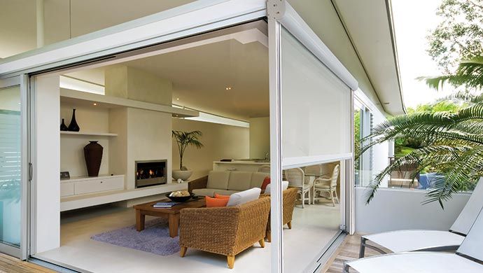Motorized Durasol outdoor solar screen shade in modern living room Irvine