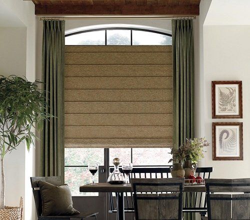 Yes you can combine roman shades with curtains and get a layered custom look.
