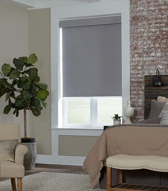 Lutron Sivoia QS Triathlon Blackout Gray Roller Shade in bedroom inside mounted fabric-wrapped headrail fascia