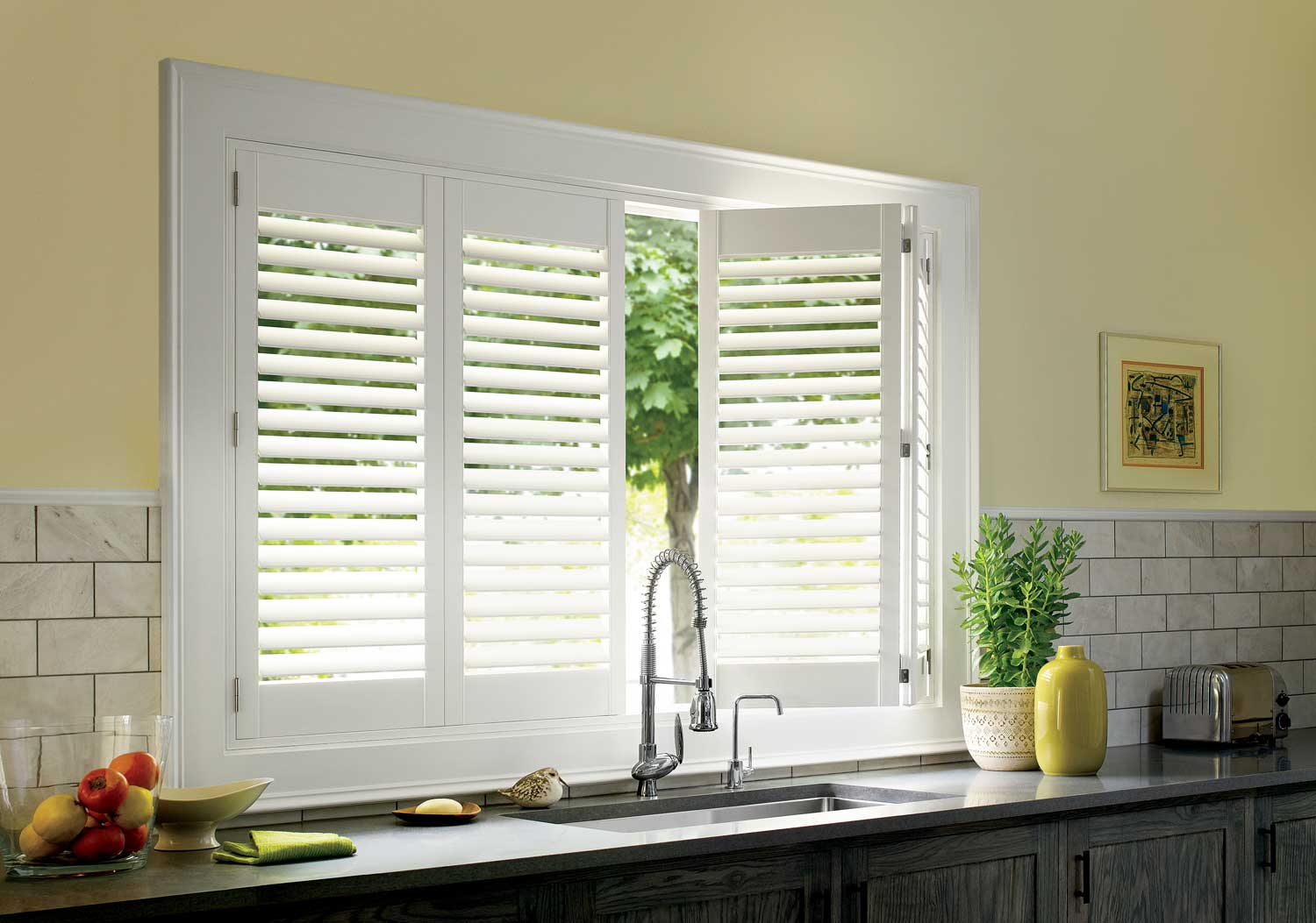 Motorized Hunter Douglas Palmbeach polysatin shutters in kitchen over the sink, alexa open my shutters Irvine