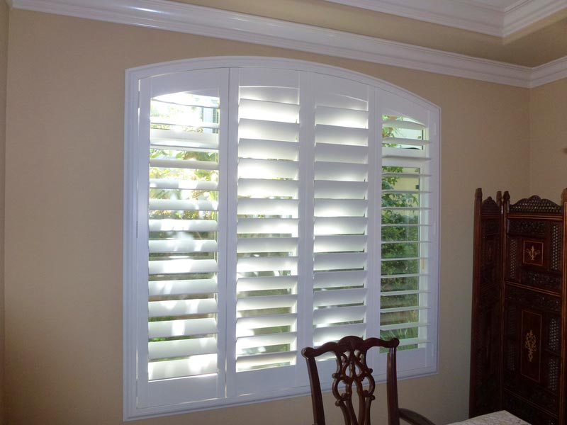 Plantation shutters in dining room in Palos Verdes