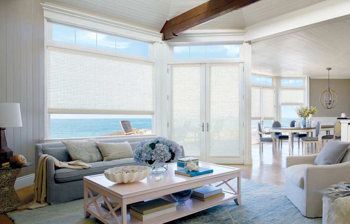 Motorized Hunter Douglas Provenance woven wood shades in coastal beach front french living room Irvine