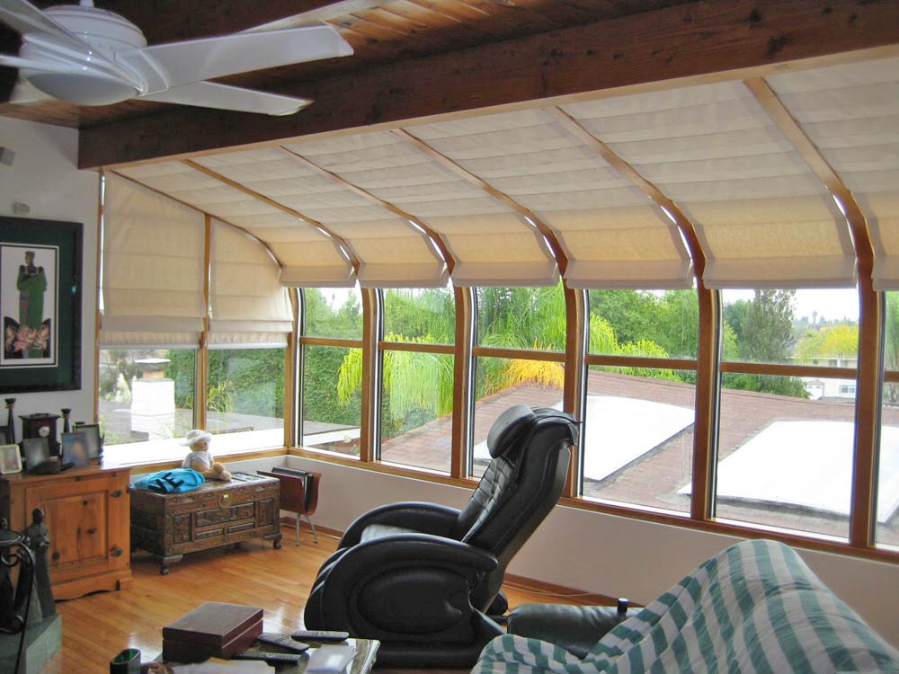 Motorized Hunter Douglas roman shade skylight in casual home office Irvine