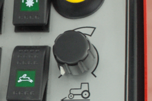 Feature for maintaining fixed driving speed when engine speed is adjusted to maintain continous flow for hydraulically powered tools ie. lawnmower. Speed Control