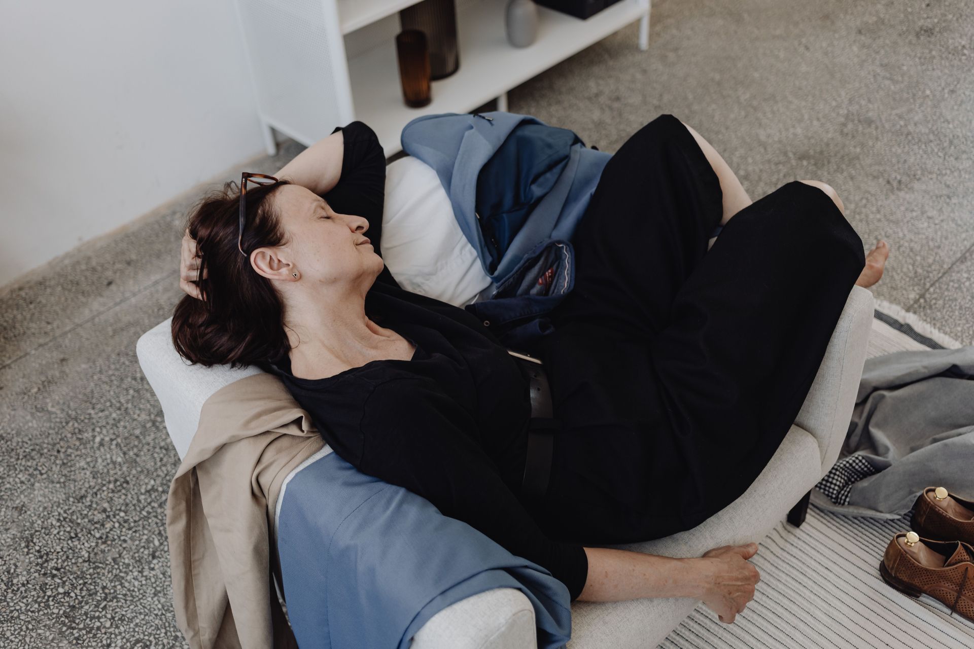 woman resting on sofa