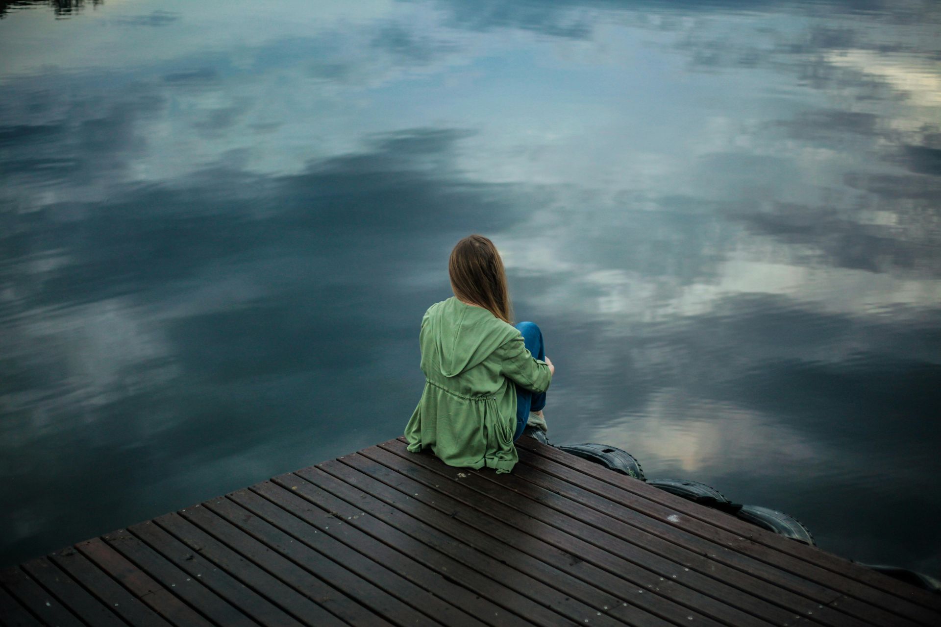 Woman looking out over a lake
