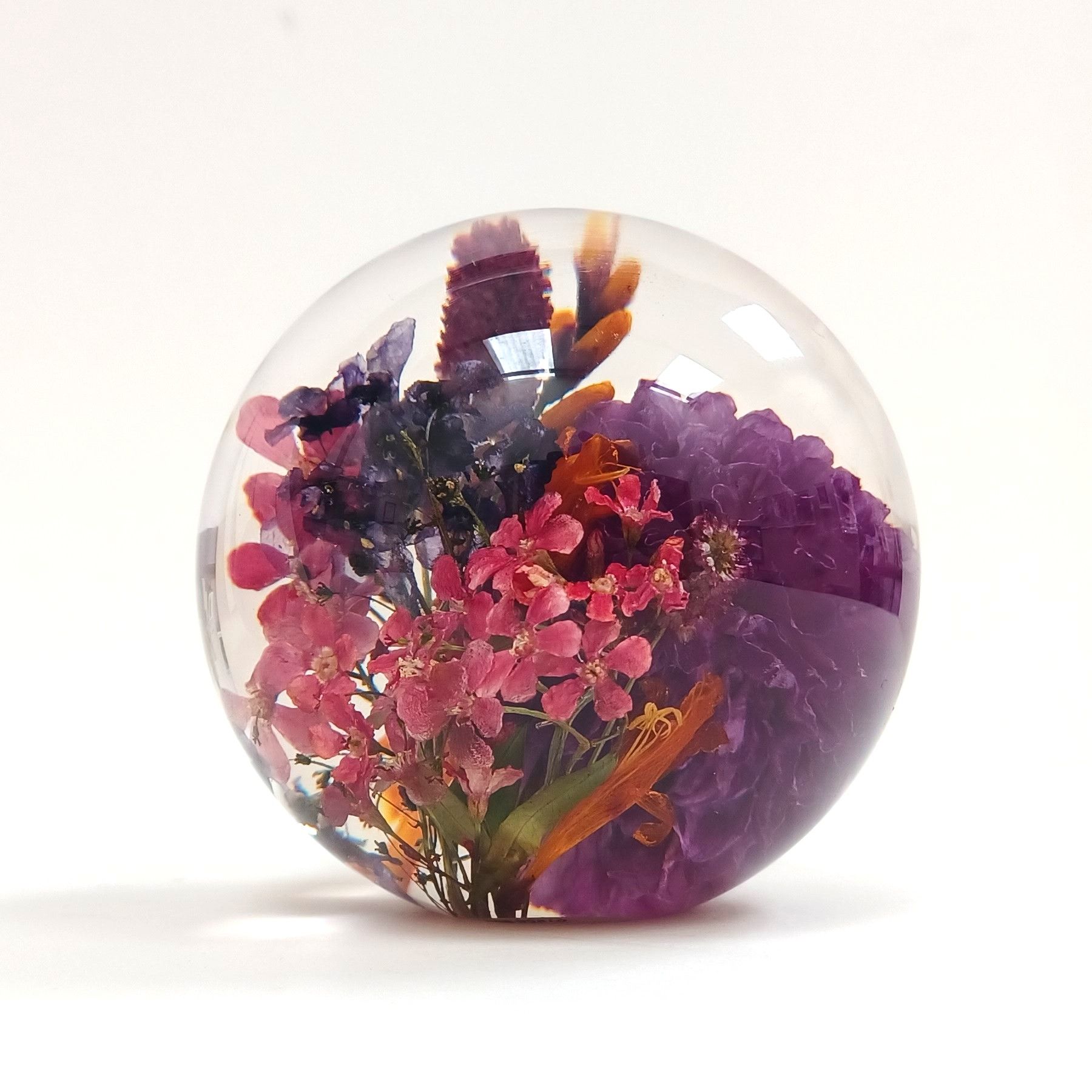selection of flowers in paperweight