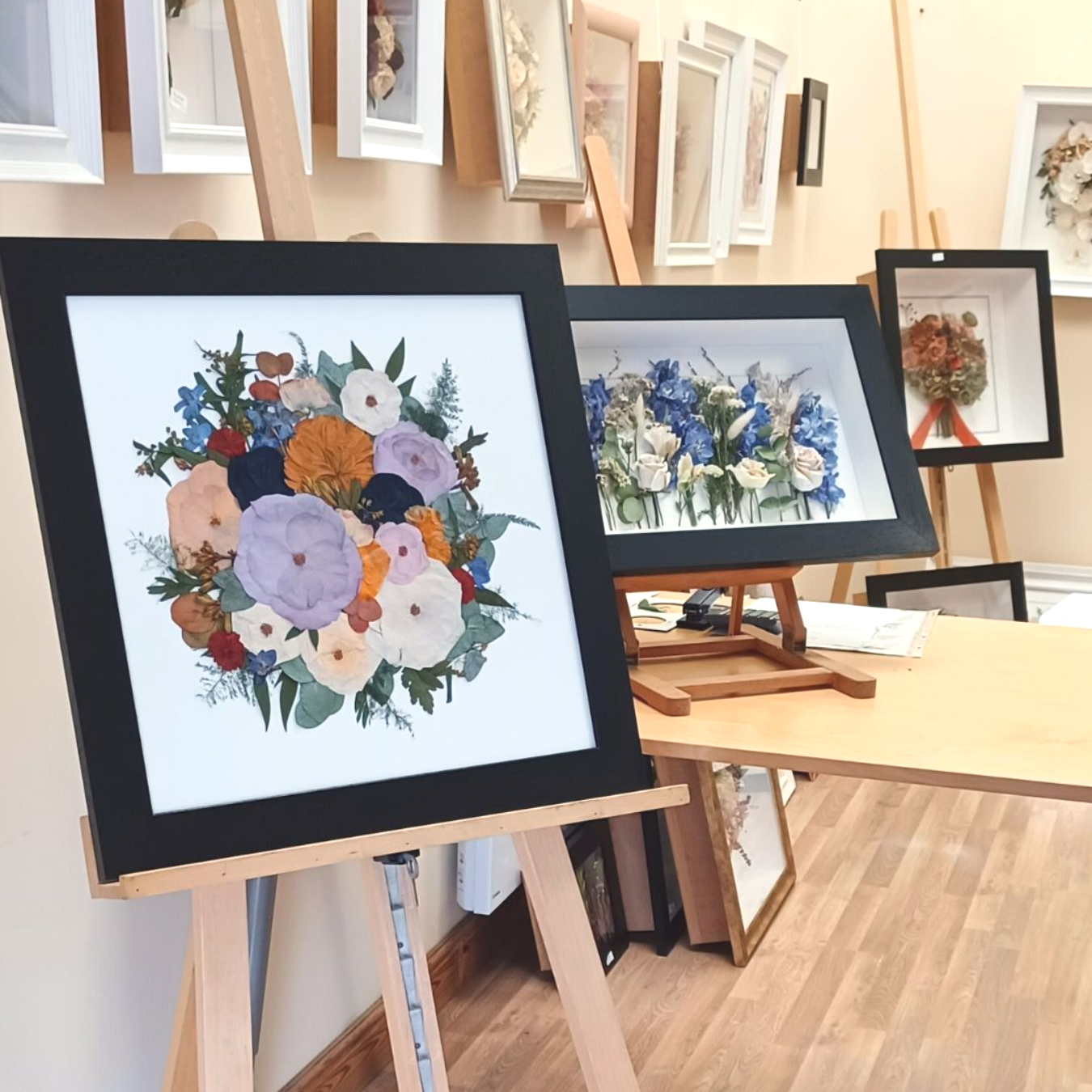 pressed bouquet in a black frame