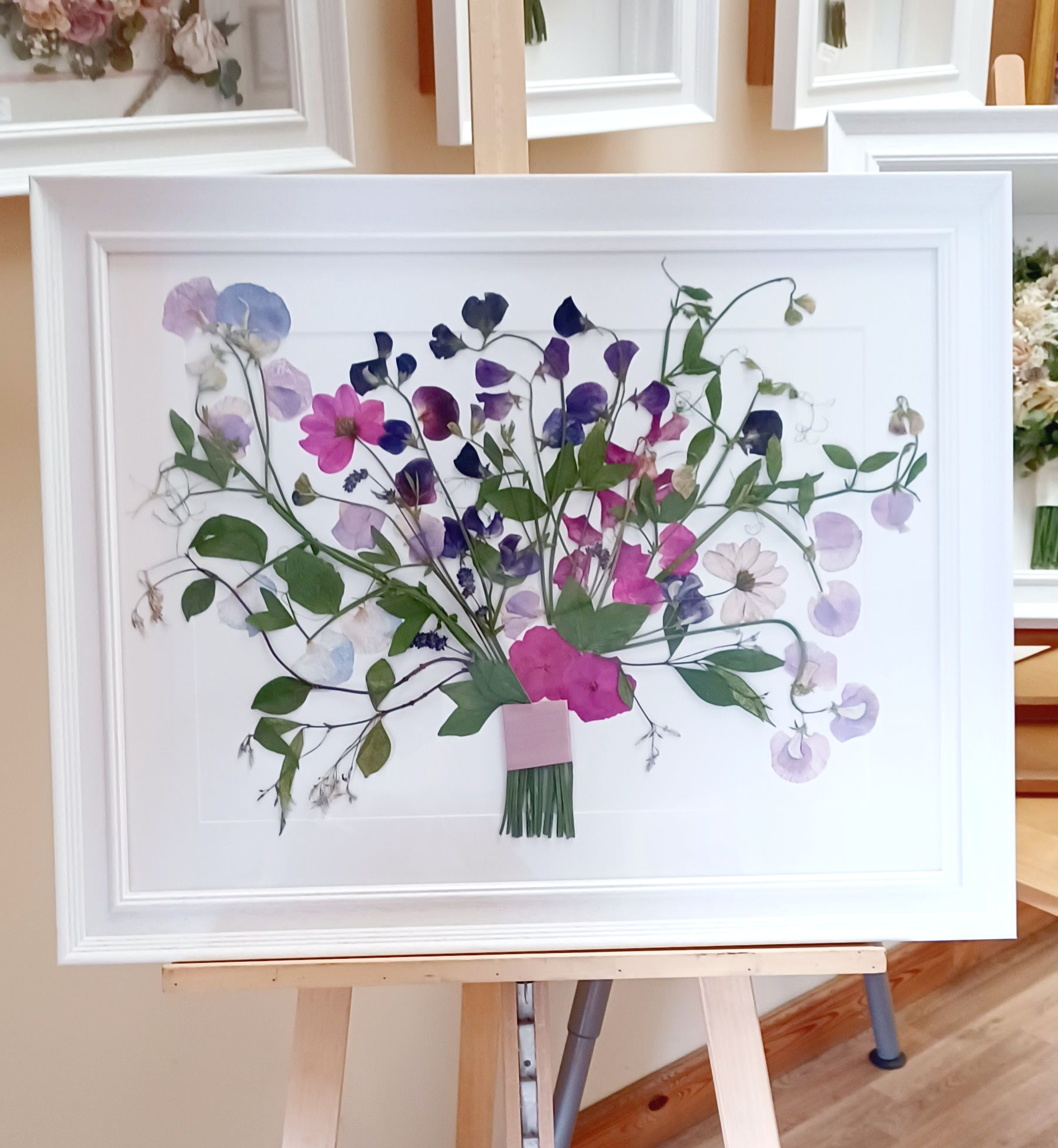 pressed sweetpeas in a frame
