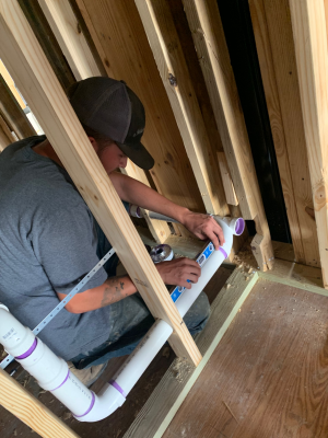 Bruce's Plumbing - An employee working new construction and remodeling.