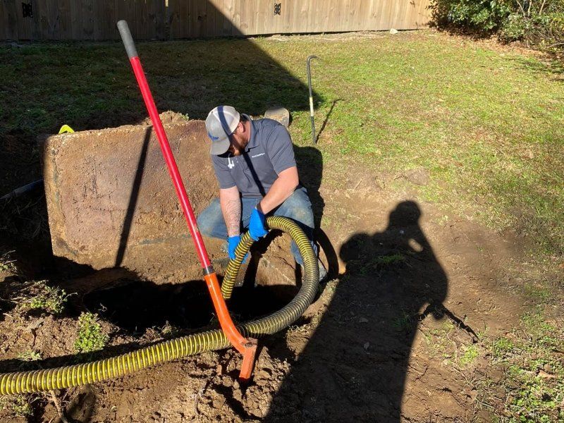 Bruce's Plumbing - Pumping a septic tank.