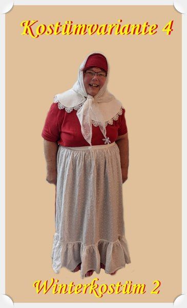 langer roter Rock, weiße Schürze, breiter weißer Kragen, rote Kappe und darüber ein weißes Kopftuch