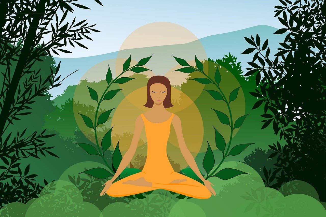 Une personne assise en tailleur médite comme si elle était dans la nature.