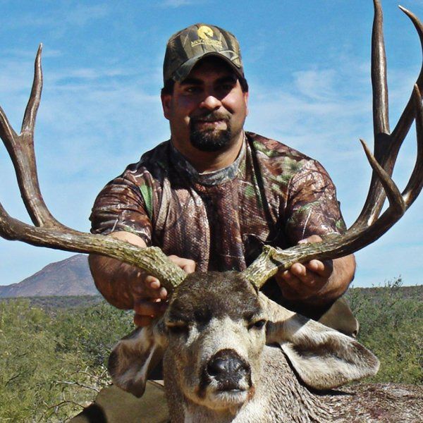 Hunter holding elk antlers