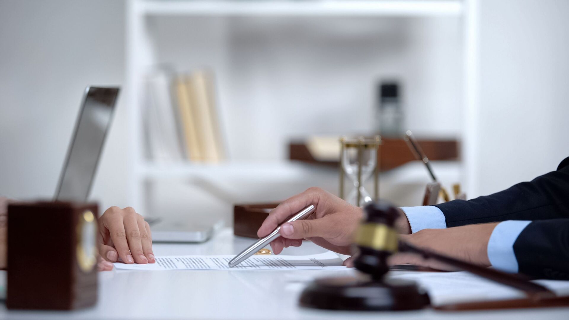 a person showing a form to a person across the table
