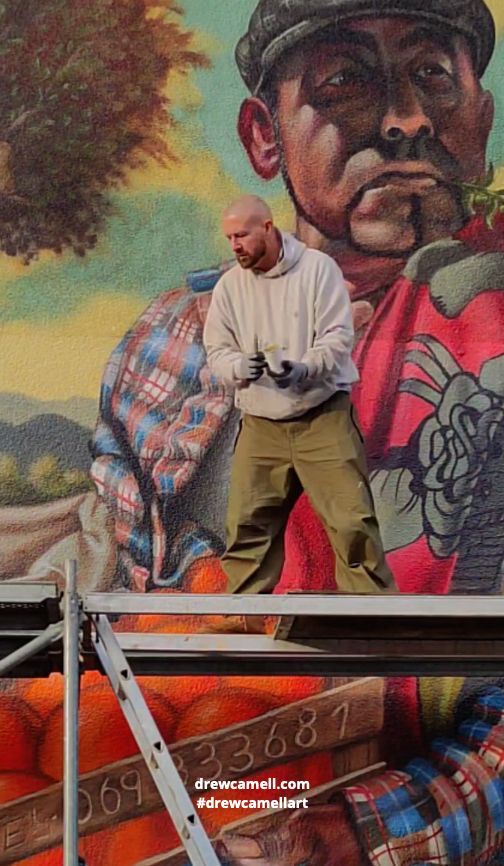 Artist Drew Camell working on his big Streetart Graffiti Mural in Frankfurt am Main
