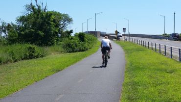 Bike riding on the Jones Beach boardwalk. Bike riding on the Jones Beach boardwalk.
