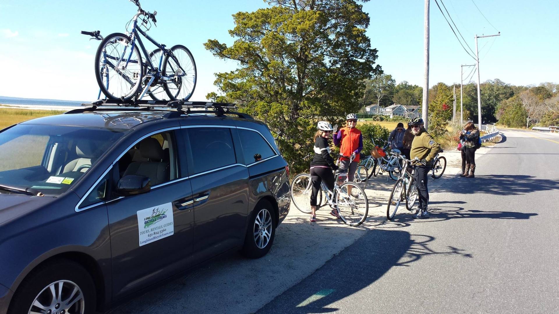 Cyclists on side of road with support van. Cyclists on side of road with support van.