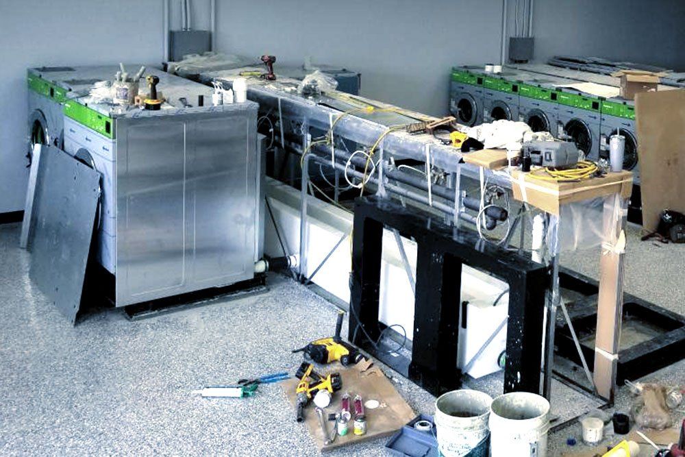 K&L Repairman Fixing Dryer Image