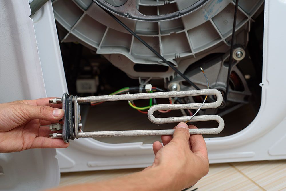 K&L Repairman Fixing Dryer Image