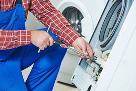 K&L Repairman Fixing Dryer Image