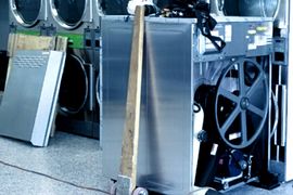 K&L Repairman Fixing Dryer Image