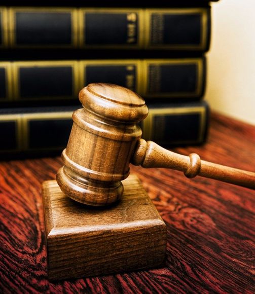 gavel with books in the background