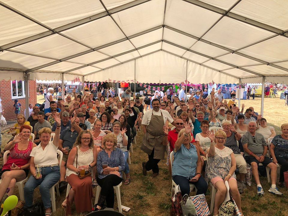 Three of the Wot's Cooking team in green.