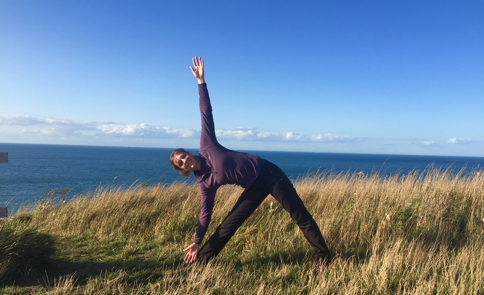 Outdoor yoga on the coast in North York Moors National Park (c) Adventures for the Soul