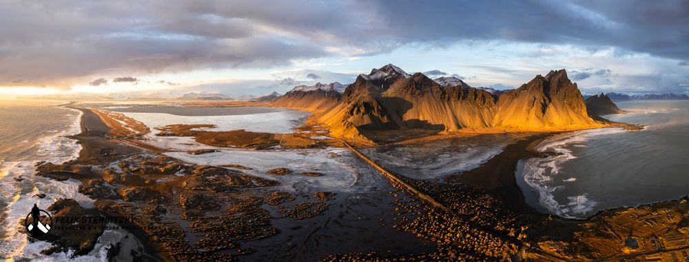 aerial panorama image from the vestrahorn mountain at sunset in iceland