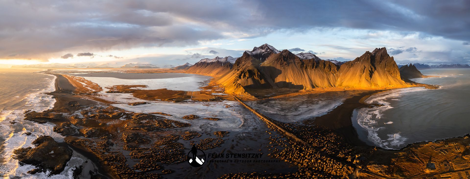 Aerial drone panorama photo of a mountain range in iceland during sunset