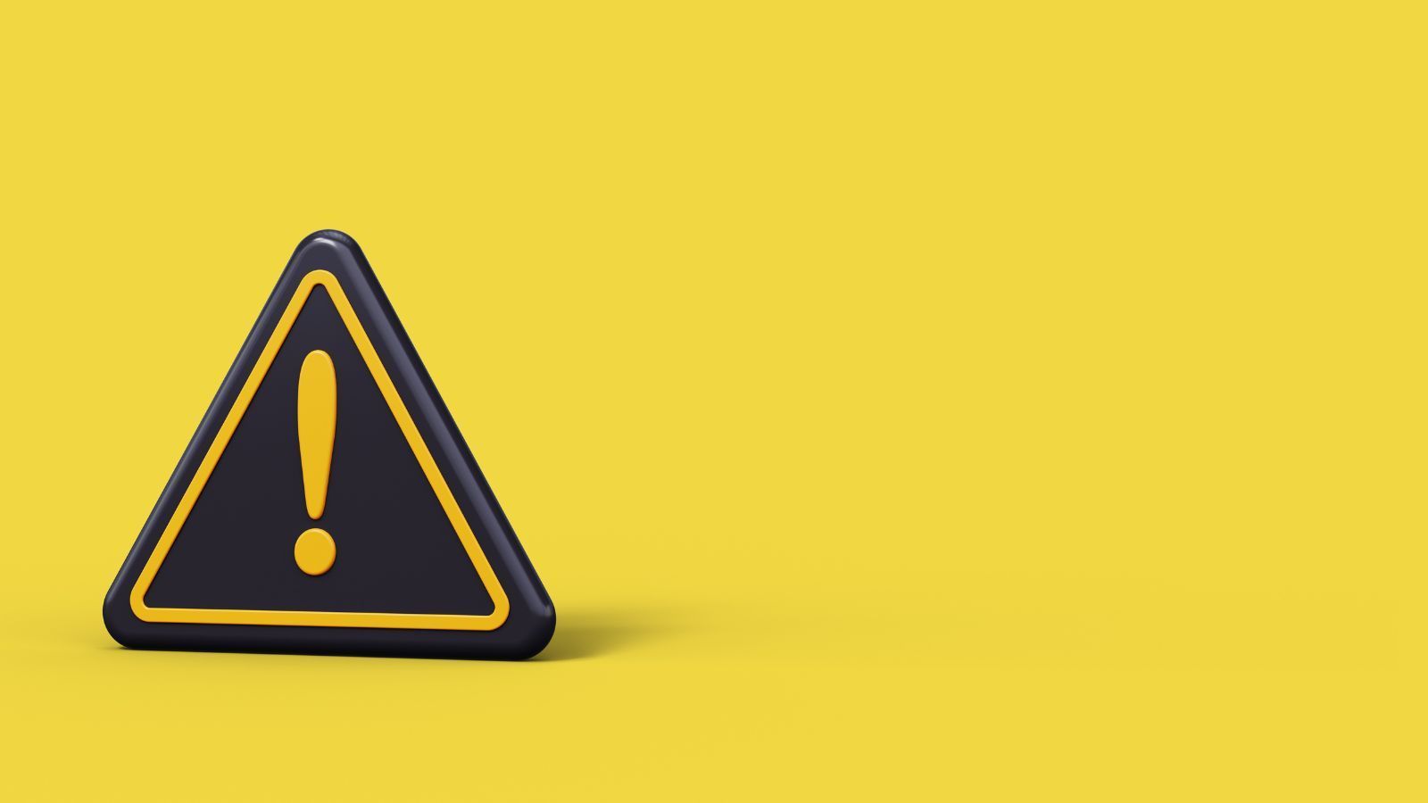Panneau triangulaire noir avec un point d'exclamation sur un fond jaune