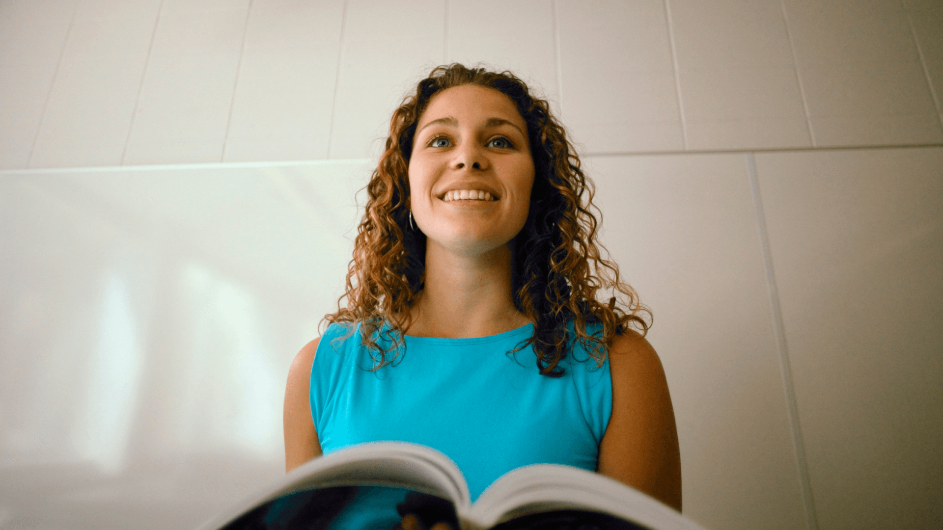 Smiling, relaxed and confident woman speaking in public