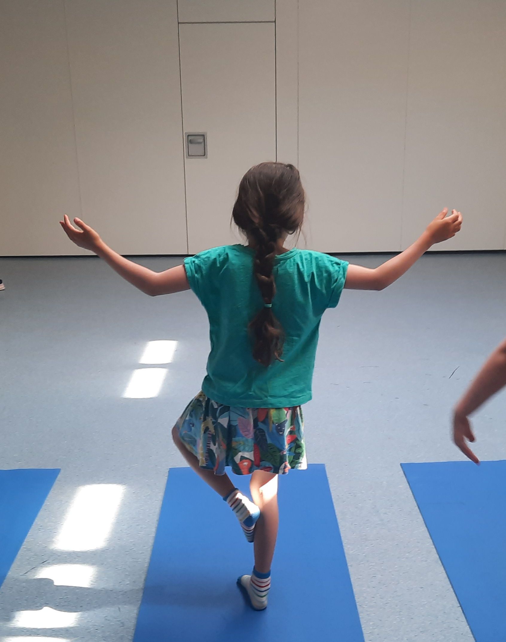 girl doing tree pose