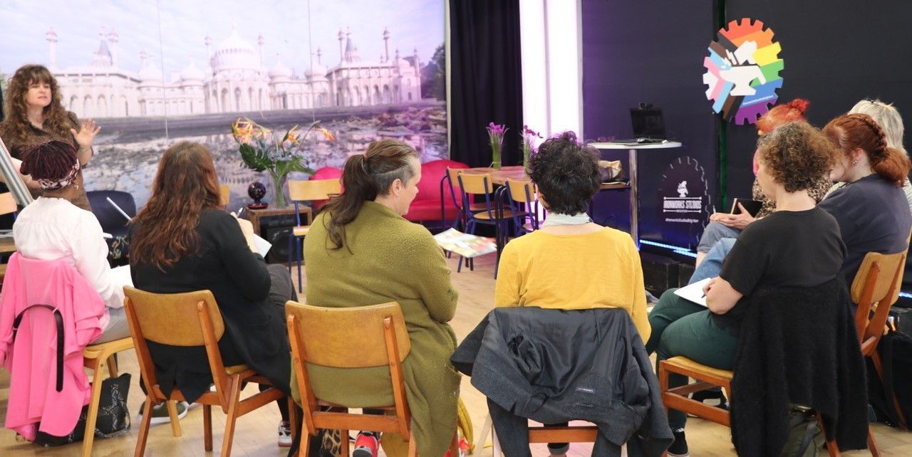 Group of artists with Dominique facilitating