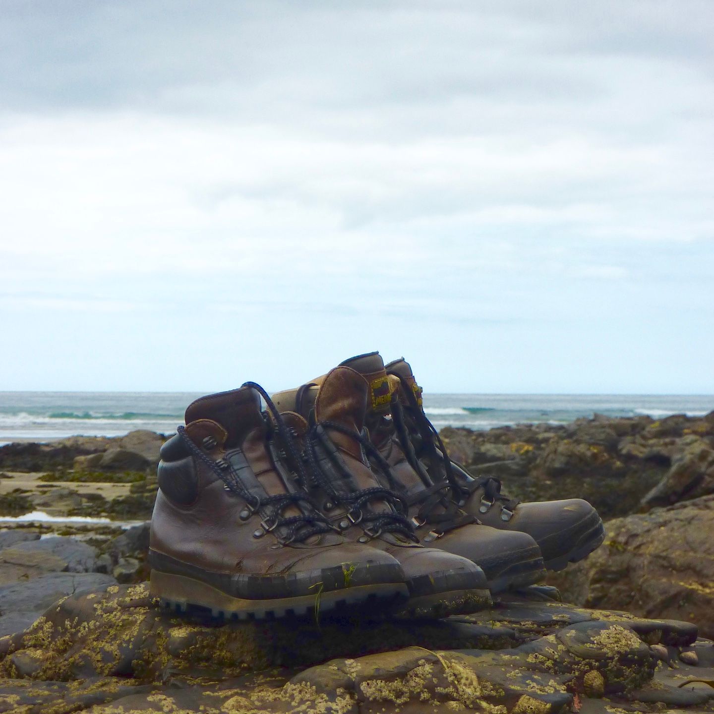 Walking boots on Crackington Haven beach