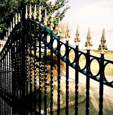 Traditional Wrought Iron Gates with finials, centre shield lock, galvanised to avoid rust and finished with durable black paint. Traditional Wrought Iron Entrance Gates