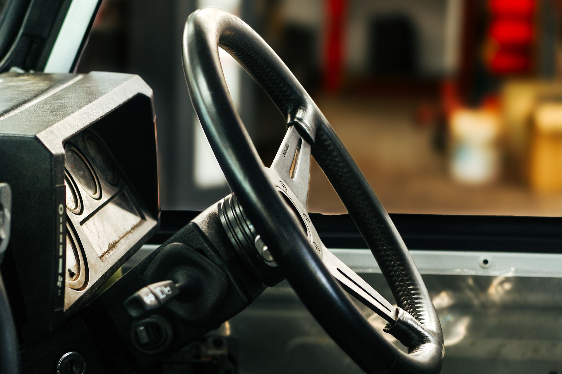 Defender interior fitted with black Moto-Lita steering wheel