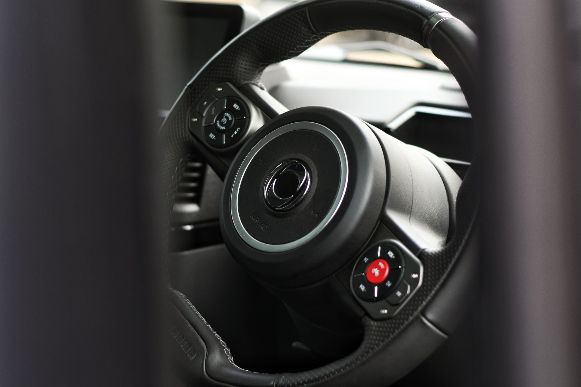 INEOS Grenadier steering wheel showcasing INEOS badge in Hampshire.