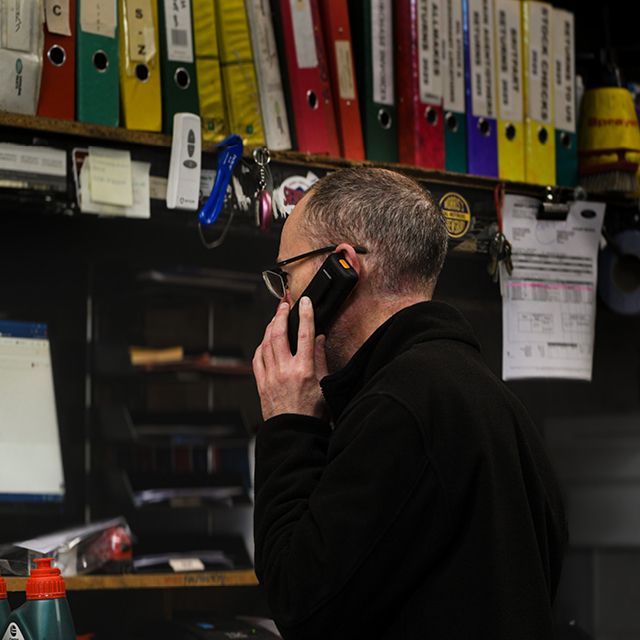 Parts advisor speaking with customer in office
