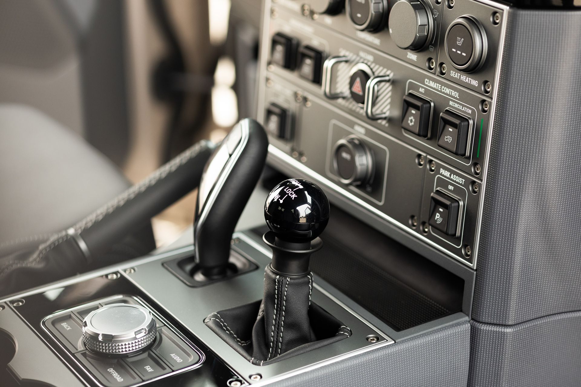 Interior detail of INEOS Grenadier cabin featuring dials and gear controls.