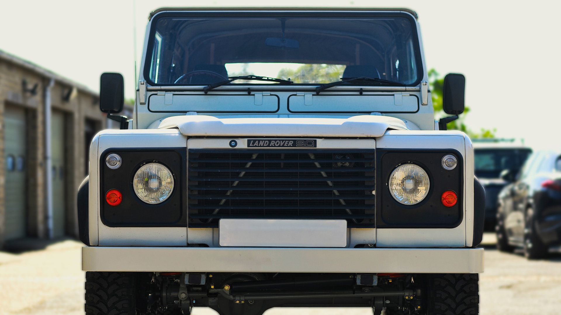 Front view of rebuilt white Defender 90 at Keith Gotts