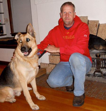 Photo of Brad Bredehoft with his German Shepherd